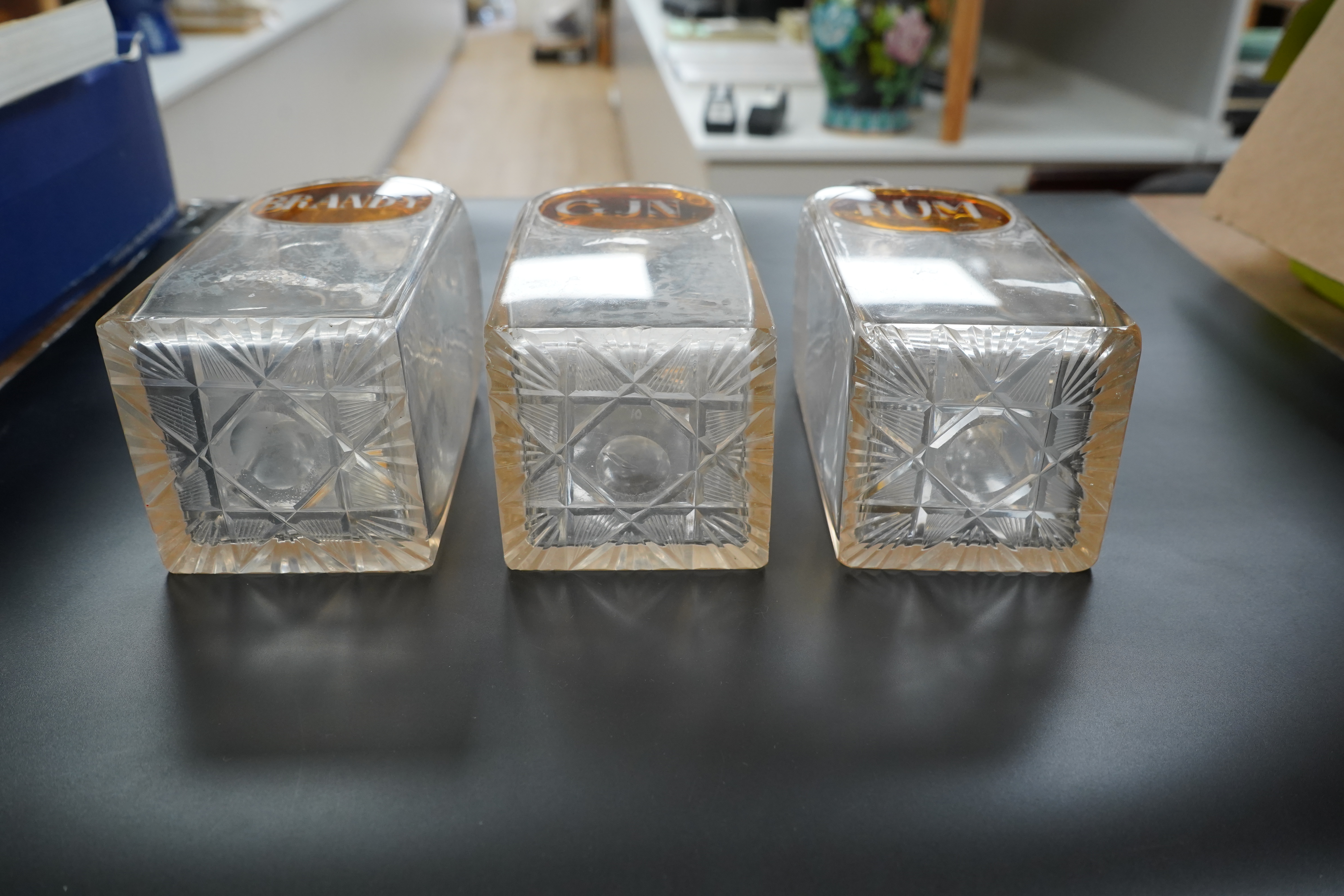 Three 19th century cut glass decanters for 'Rum' 'Gin' and 'Brandy', 23cm high